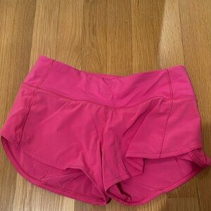 size 2 speed up 2.5 inch pink lululemon shorts, minor stain on inside